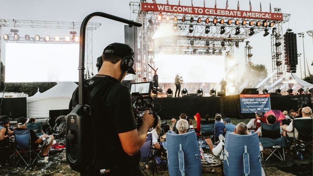 Cole Morell operating a Blackmagic URSA camera at a live event, founder of Layout Media and creative filmmaker in California